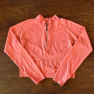 Peach long sleeve athletic top, quarter zip, slightly cropped